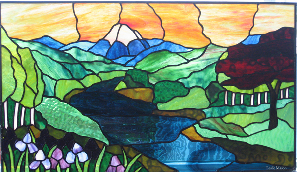 a river with a red tree