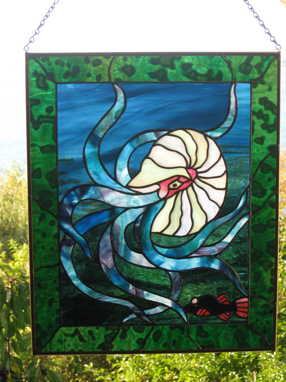 a nautilus and a small fish