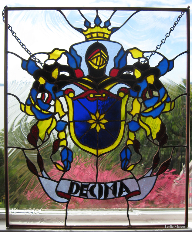 a blue, yellow, and red knight emblem with 'Decima' at the bottom