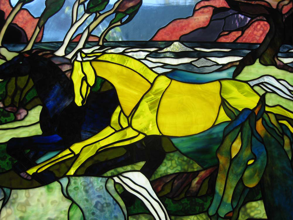 three colorful horses running
