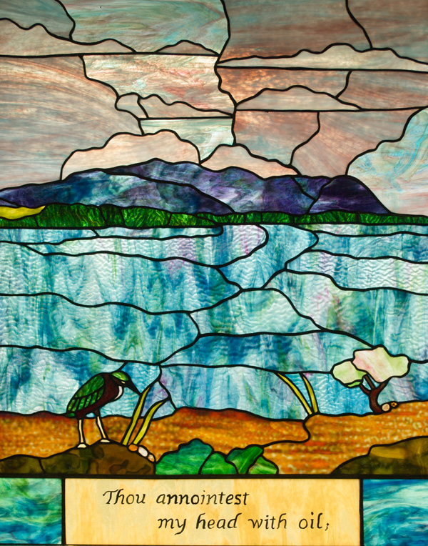 a green heron in mud flats, 'thou anointest my head with oil'