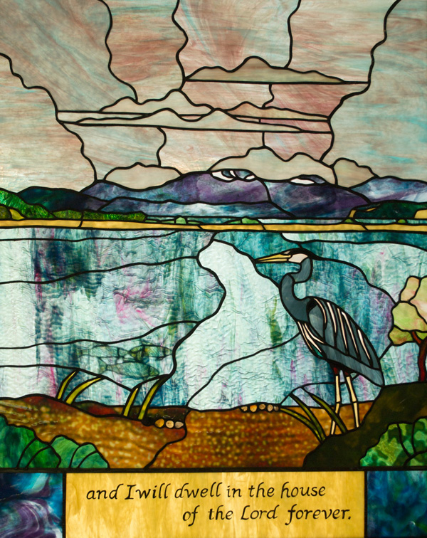 a blue heron in mud flats 'and I will dwell in the house of the lord forever'